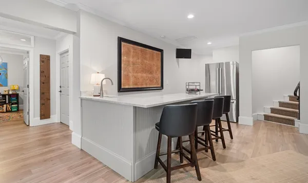 a view of a house with a yard and sitting area