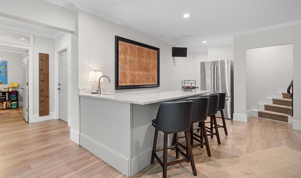 220 Wake Robin Drive Jasper, GA 30143 - Photo 49 of 81 a kitchen with stainless steel appliances kitchen island granite countertop a table chairs and a refrigerator