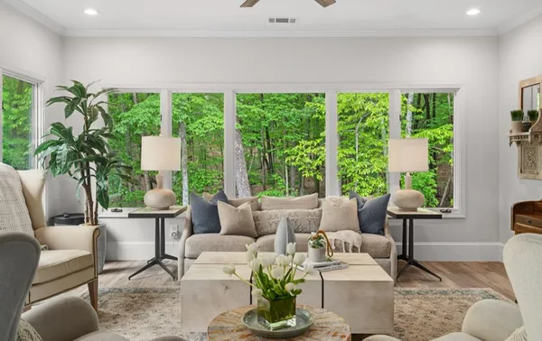 a living room with furniture and a large window
