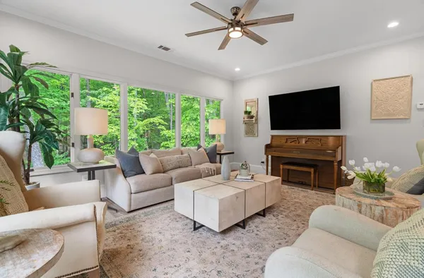 a living room with furniture and a large window