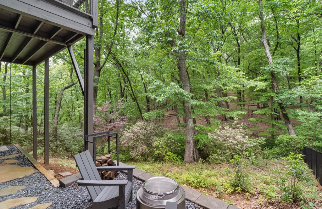 220 Wake Robin Drive Jasper, GA 30143 - Photo 61 of 81 a view of a backyard with table and chairs and potted plants