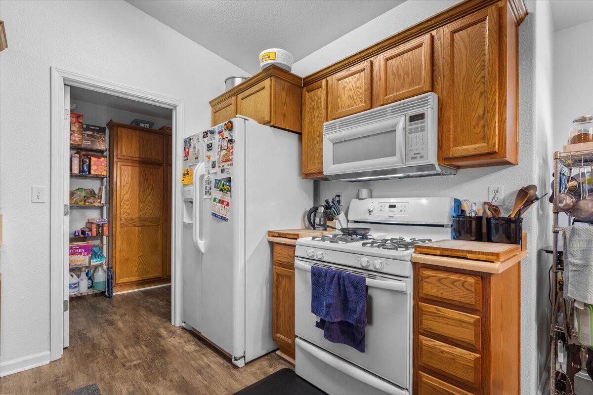 726 Stonebriar Trail Redding, CA 96003 - Photo 11 of 26 a utility room with fridge dryer and washer