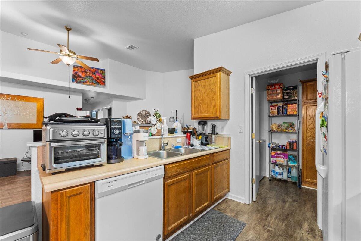 726 Stonebriar Trail Redding, CA 96003 - Photo 12 of 26 a kitchen that has a lot of cabinets stainless steel appliances and a counter top space