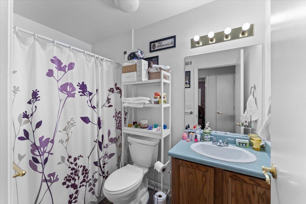 726 Stonebriar Trail Redding, CA 96003 - Photo 14 of 26 a bathroom with a sink toilet and shower