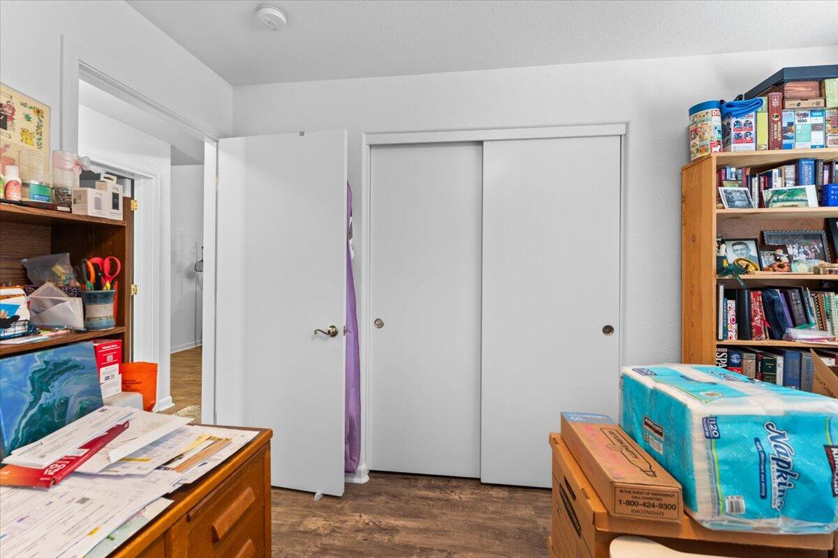 726 Stonebriar Trail Redding, CA 96003 - Photo 15 of 26 a room with furniture and a book shelf