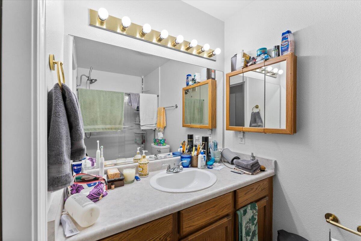 726 Stonebriar Trail Redding, CA 96003 - Photo 16 of 26 a bathroom with a sink double vanity and a mirror