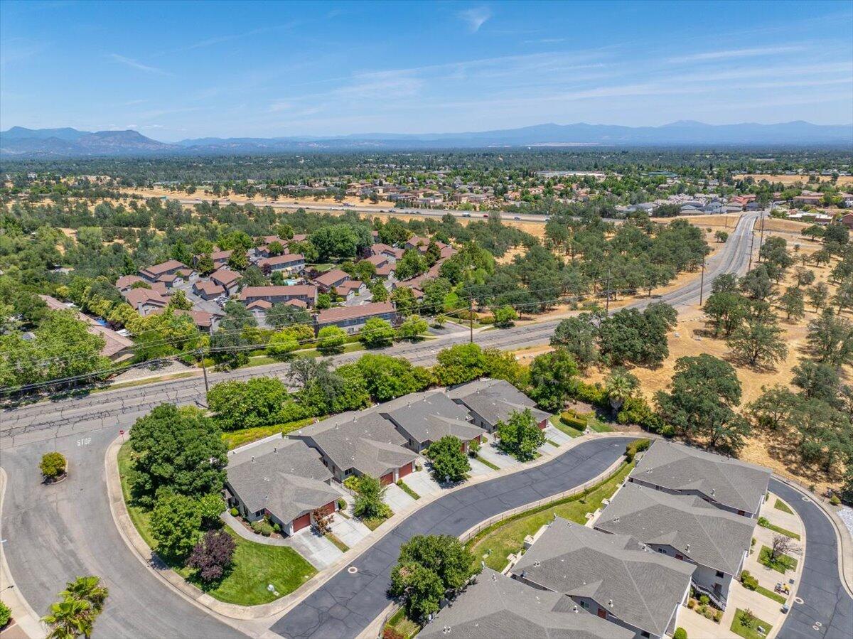726 Stonebriar Trail Redding, CA 96003 - Photo 24 of 26 an aerial view of a house with a garden