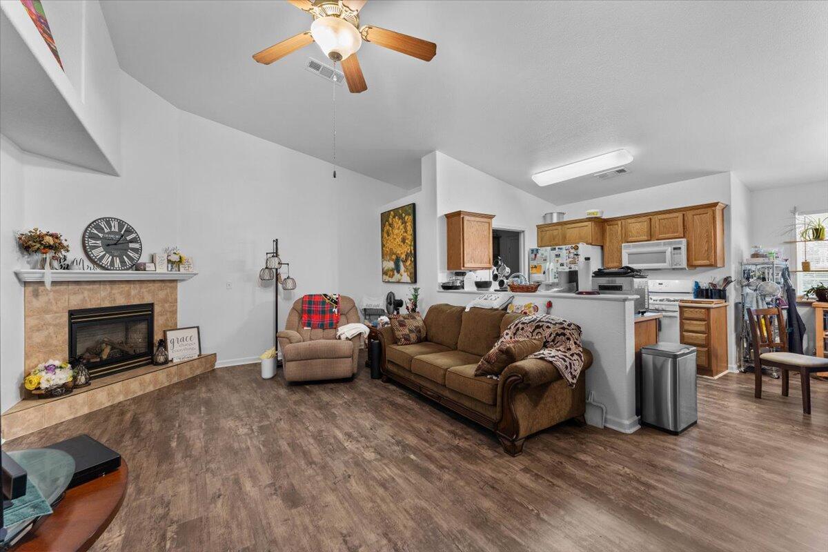 726 Stonebriar Trail Redding, CA 96003 - Photo 6 of 26 a living room with furniture and a fireplace