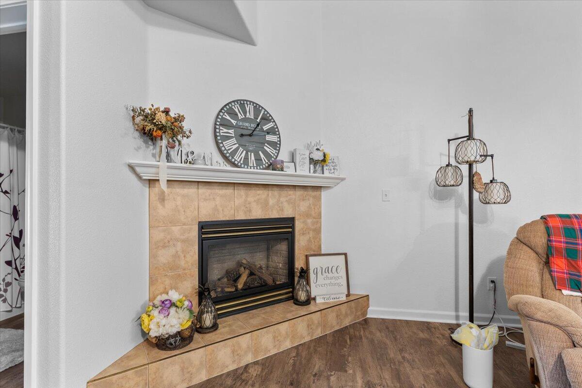 726 Stonebriar Trail Redding, CA 96003 - Photo 8 of 26 a living room with furniture and a fireplace