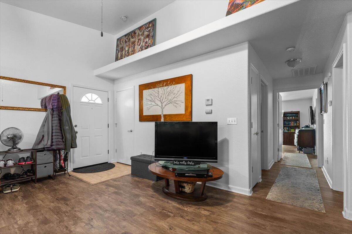 726 Stonebriar Trail Redding, CA 96003 - Photo 9 of 26 a living room with furniture and a flat screen tv