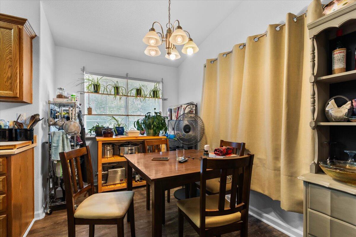 726 Stonebriar Trail Redding, CA 96003 - Photo 10 of 26 a view of a dining room with furniture and chandelier