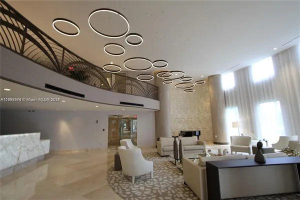 a view of a living room and entryway