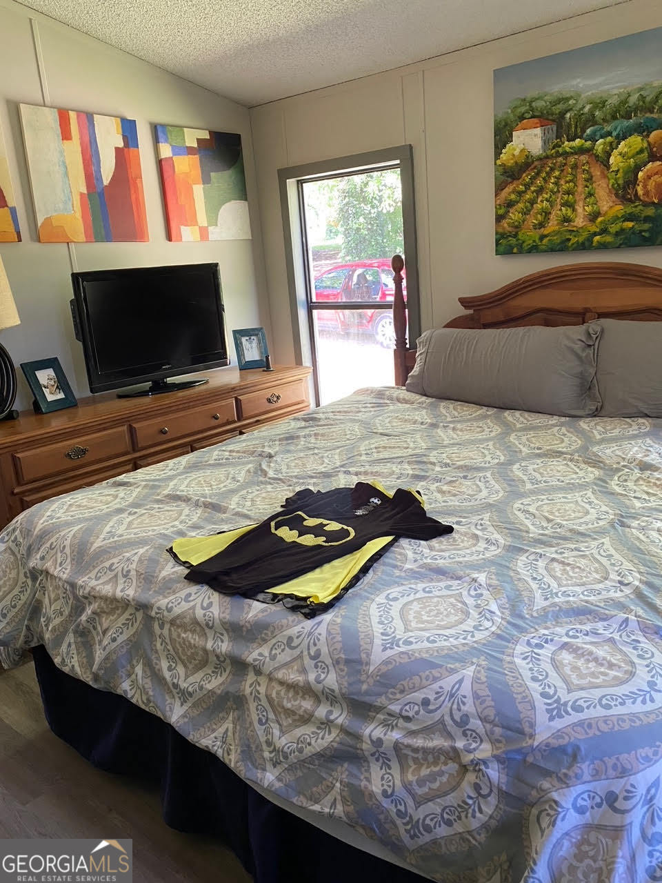 160 Scott Road Canton, GA 30115 - Photo 9 of 11 a bedroom with a bed and a flat screen tv