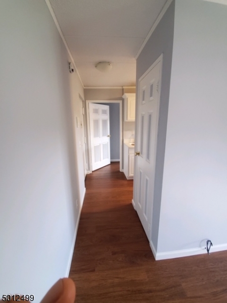 149 Main Street, Unit 3A Millburn, NJ 07041 - Photo 2 of 6 a view of a hallway with wooden floor