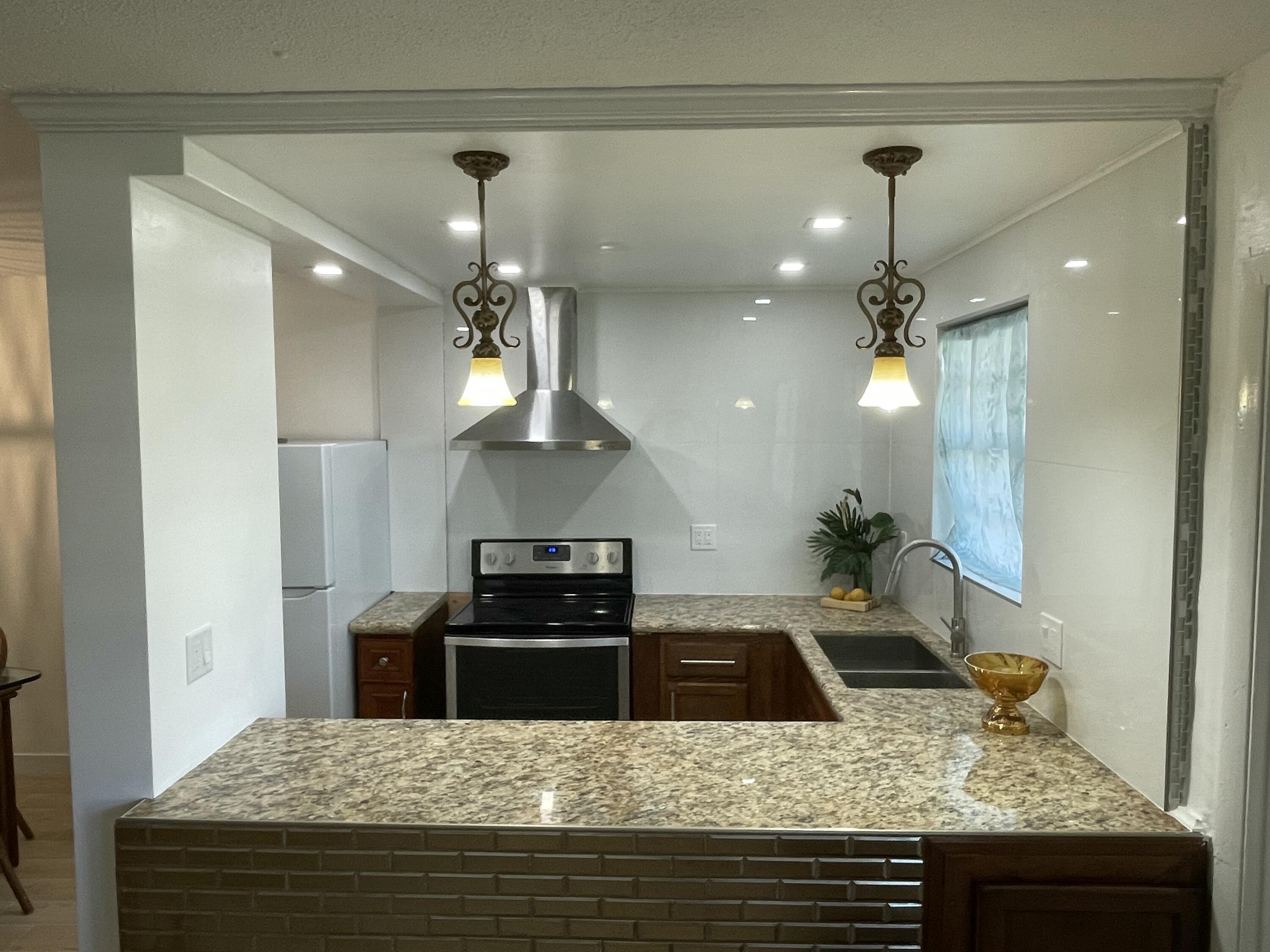 30 Southeast 13th Street, Unit A2 Boca Raton, FL 33432 - Photo 4 of 26 granite and high gloss porcelain