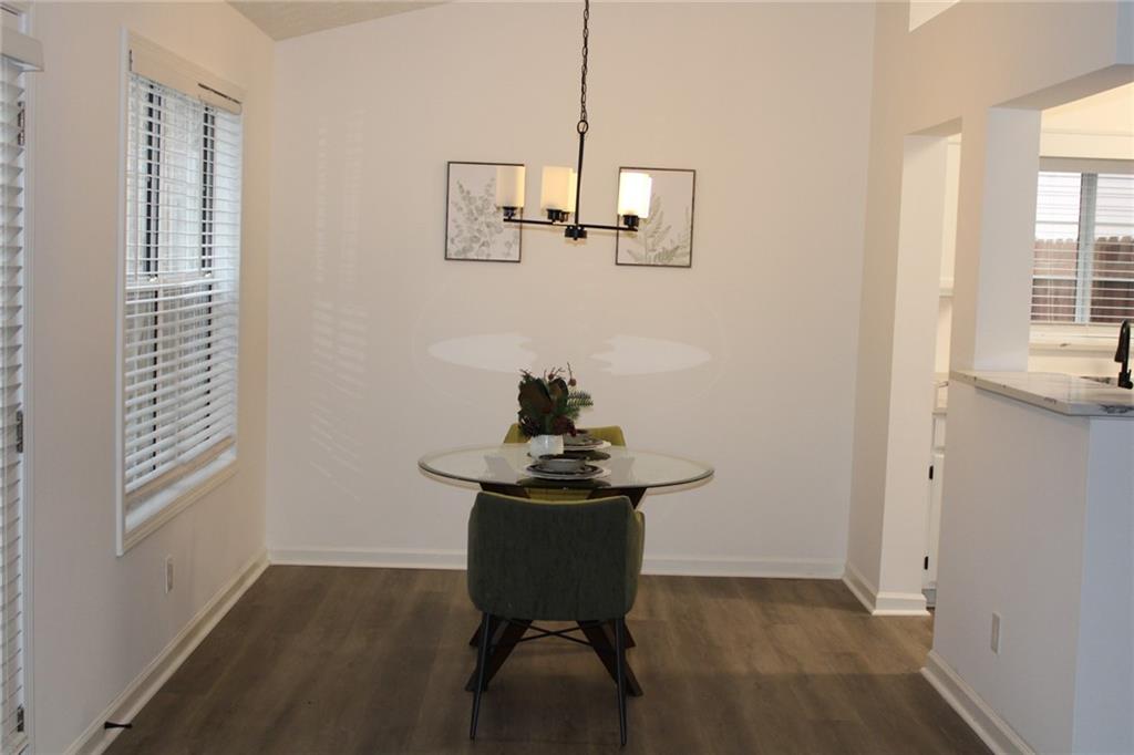 3389 Lochness Lane Powder Springs, GA 30127 - Photo 13 of 48 a view of a workspace with furniture and a window