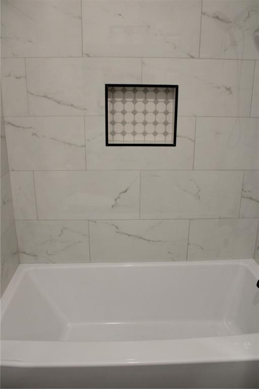 3389 Lochness Lane Powder Springs, GA 30127 - Photo 21 of 48 a bathroom with a bathtub