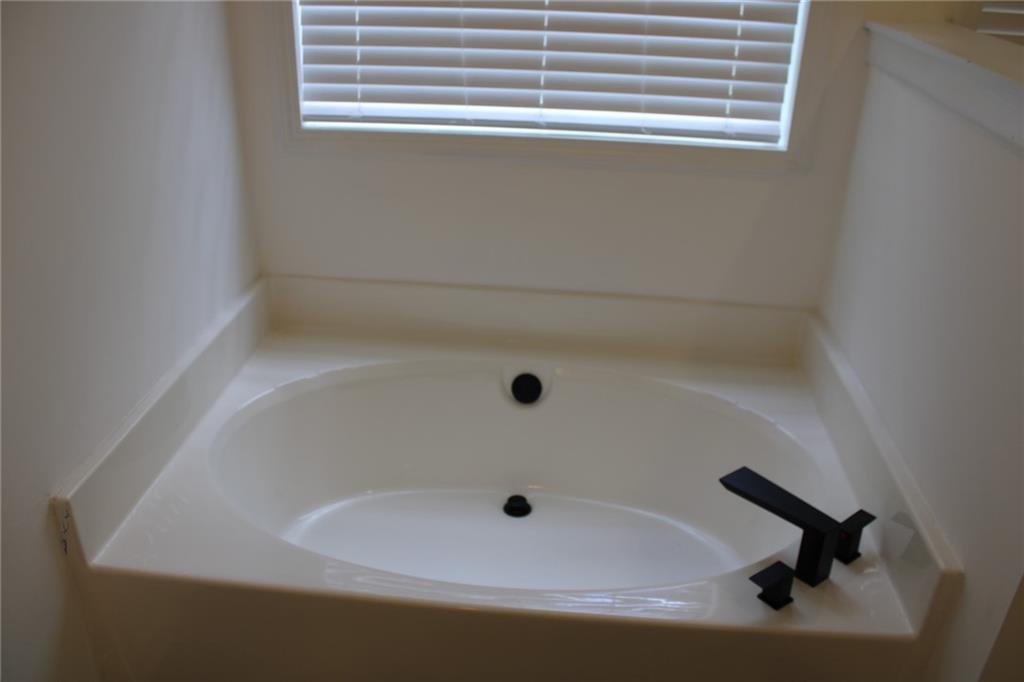 3389 Lochness Lane Powder Springs, GA 30127 - Photo 28 of 48 a bathroom with a sink