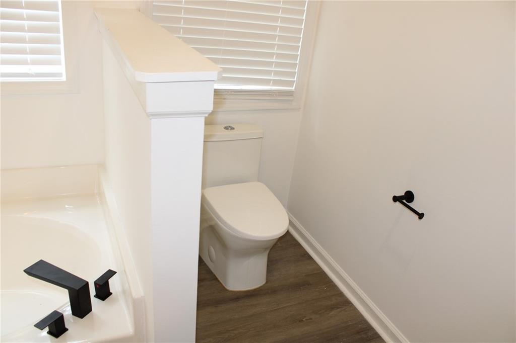 3389 Lochness Lane Powder Springs, GA 30127 - Photo 29 of 48 a bathroom with a toilet