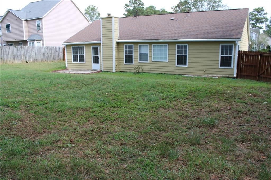 3389 Lochness Lane Powder Springs, GA 30127 - Photo 44 of 48 a front view of a house with a yard