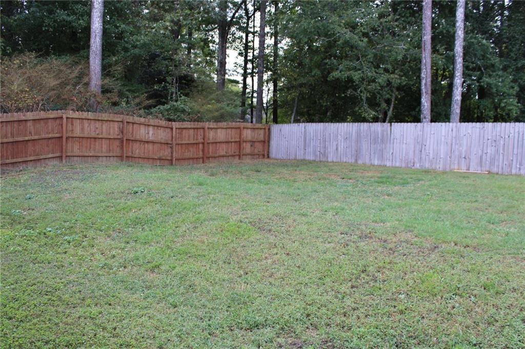 3389 Lochness Lane Powder Springs, GA 30127 - Photo 48 of 48 a view of outdoor space with deck and backyard