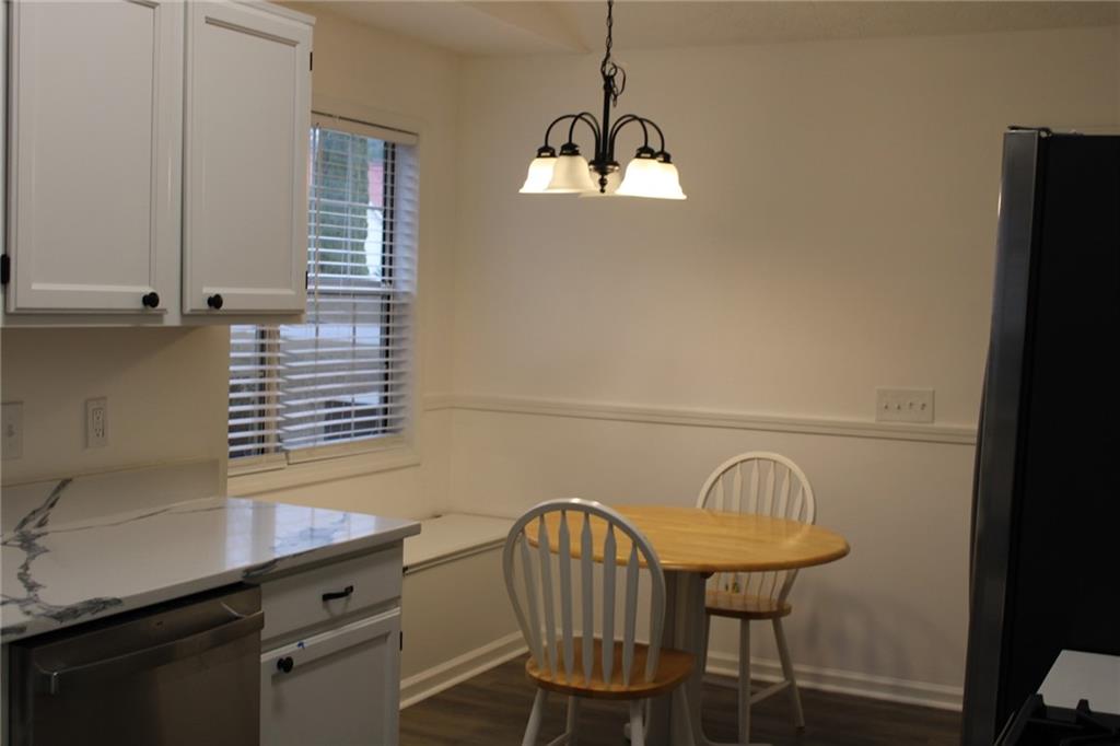 3389 Lochness Lane Powder Springs, GA 30127 - Photo 7 of 48 a view of a room with a table and chairs