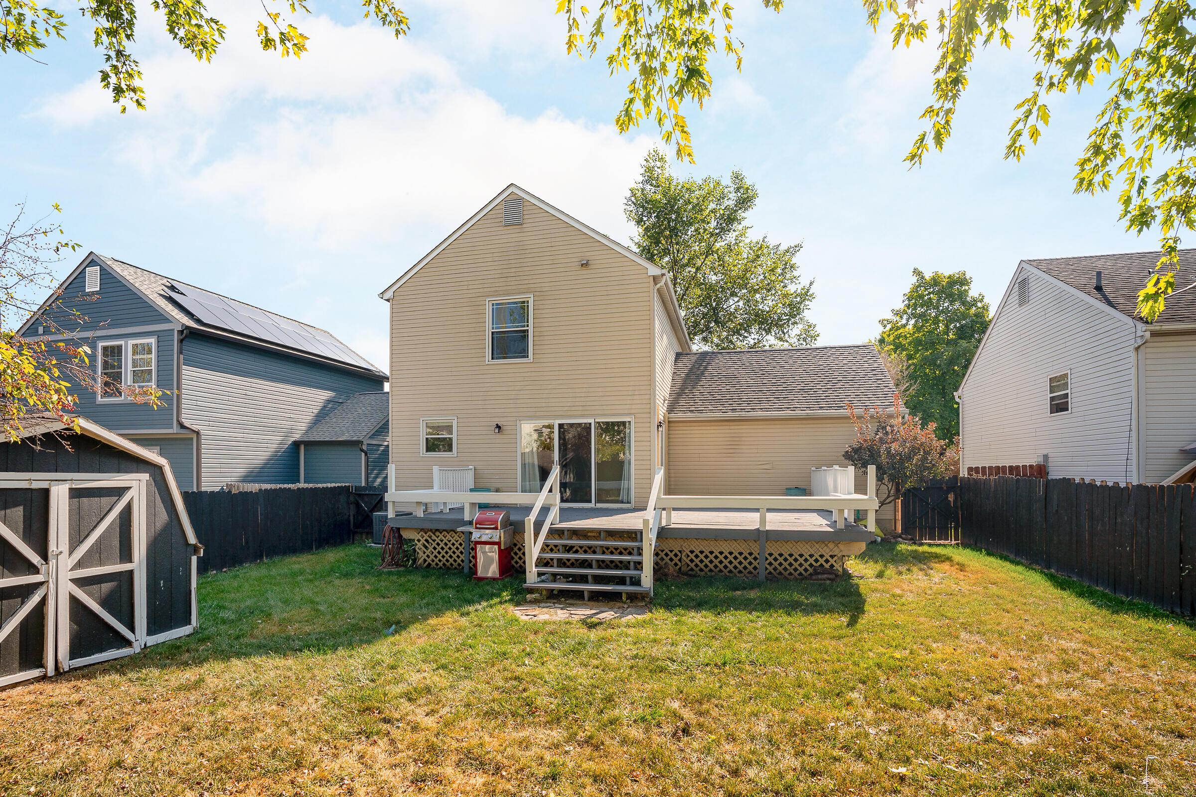 2135 Tonda Lane Grove City, OH 43123 - Photo 2 of 37 The back of the home with a large deck overlooking the fenced yard