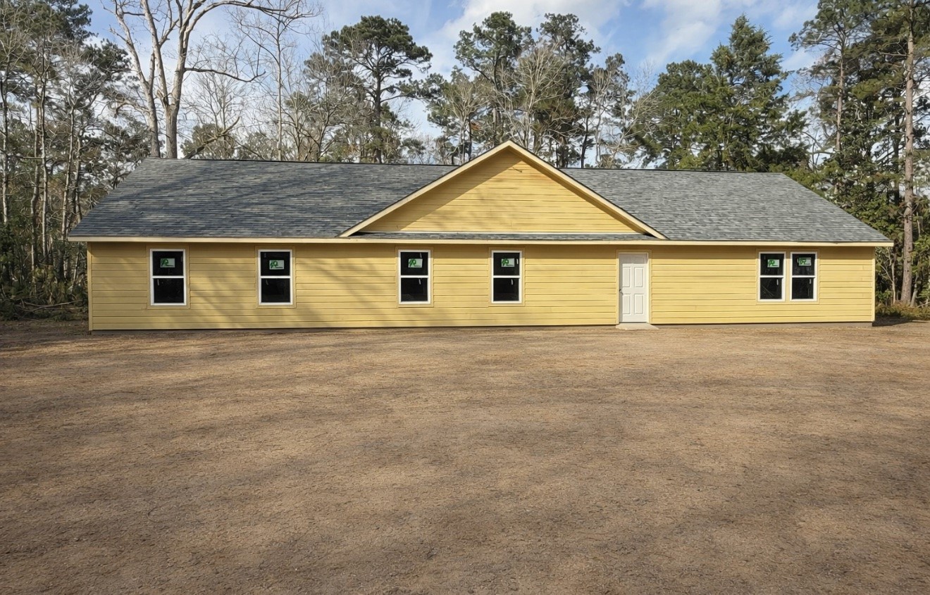 Tbd Deane Drive Livingston, TX 77351 - Photo 2 of 7 a view of a house with a backyard