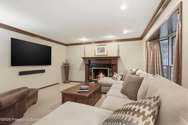 a bedroom with a bed and large glass window