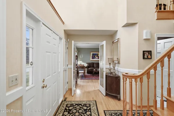 a large kitchen with stainless steel appliances granite countertop a stove a sink a table and chairs