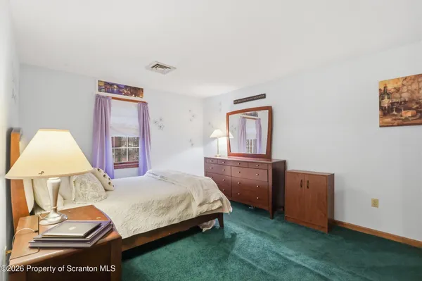 a view of a house with a street