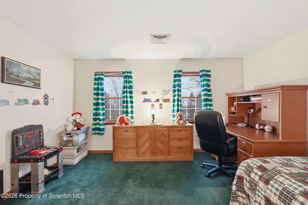 a view of a yard with a large tree