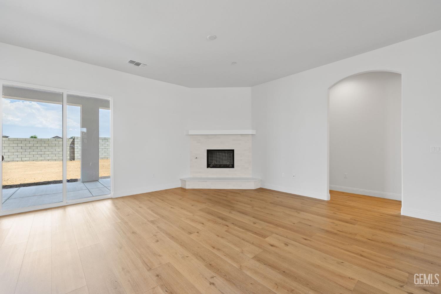 Undisclosed Address Bakersfield, CA 93314 - Photo 14 of 43 a view of an empty room with wooden floor and a window