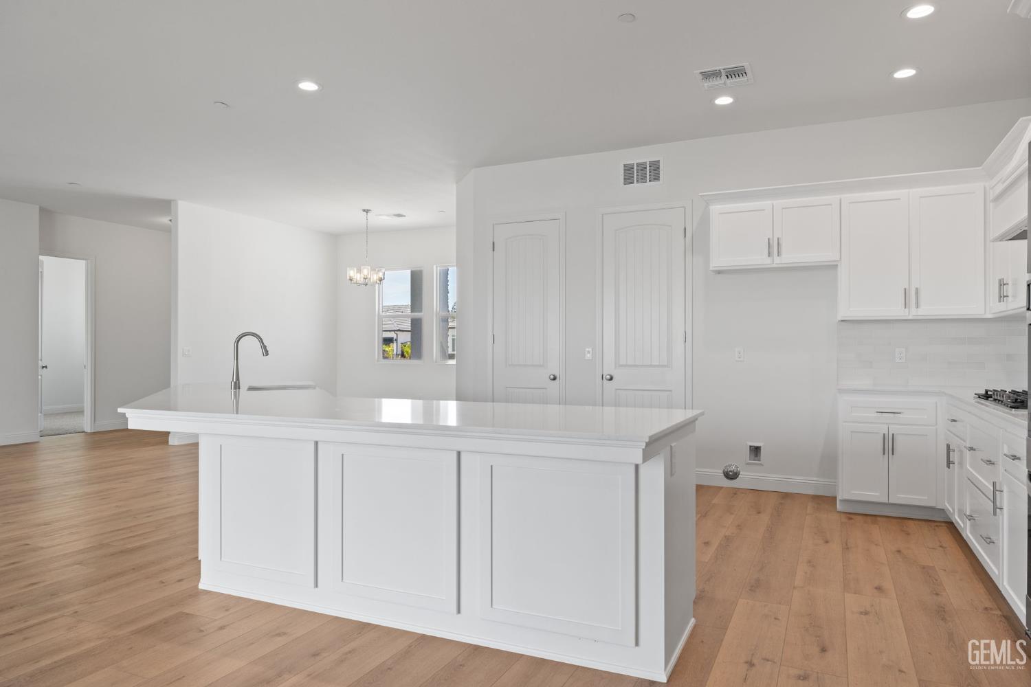 Undisclosed Address Bakersfield, CA 93314 - Photo 19 of 43 a kitchen with white cabinets and sink