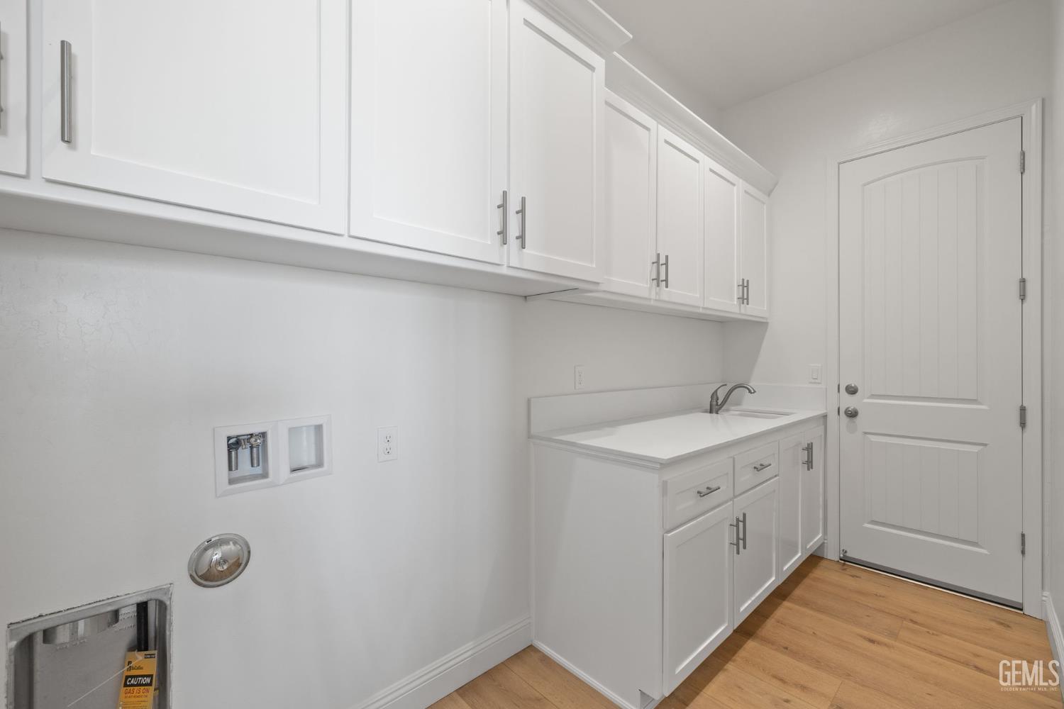Undisclosed Address Bakersfield, CA 93314 - Photo 21 of 43 a utility room with cabinets