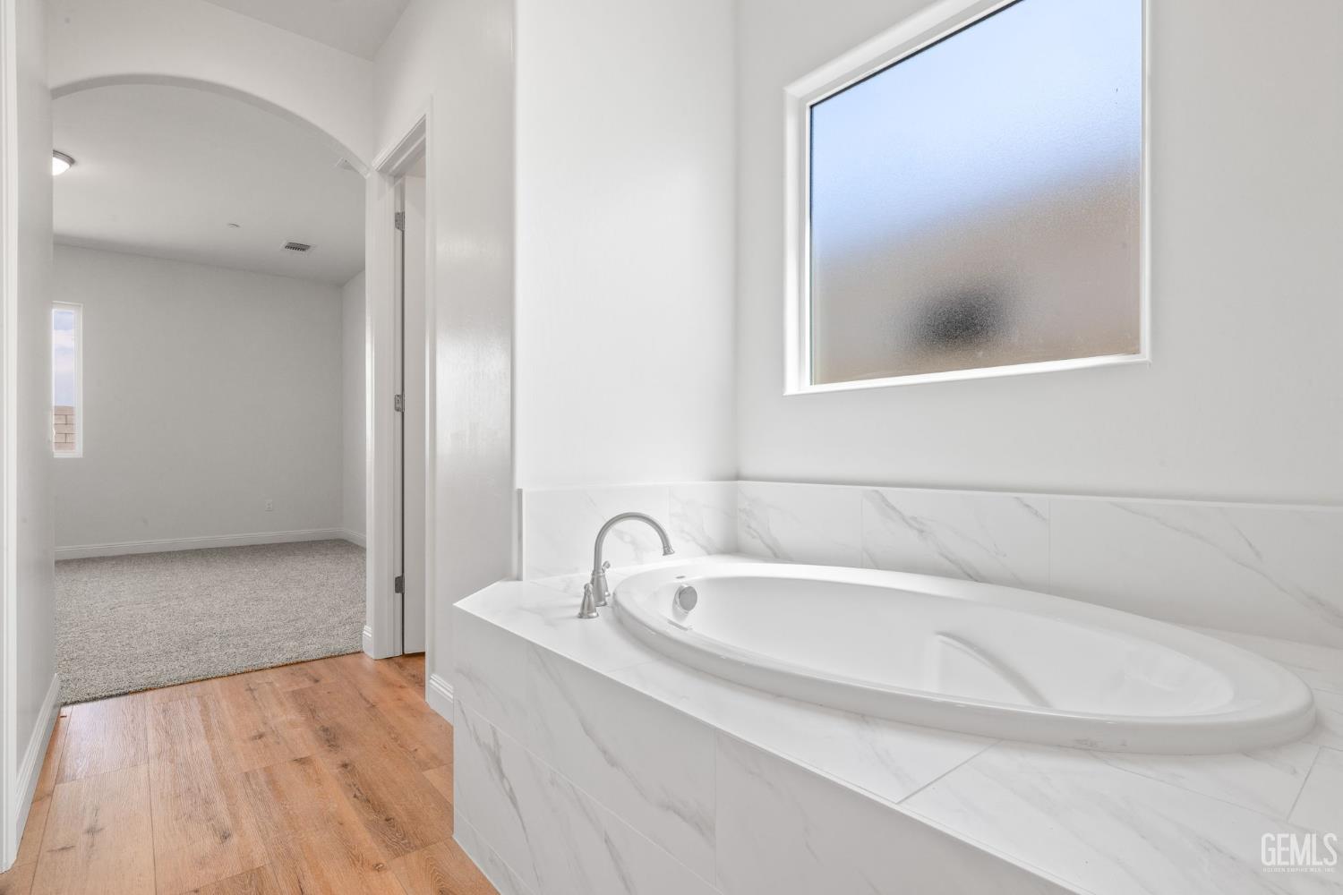 Undisclosed Address Bakersfield, CA 93314 - Photo 30 of 43 a bathroom with a bathtub and a sink