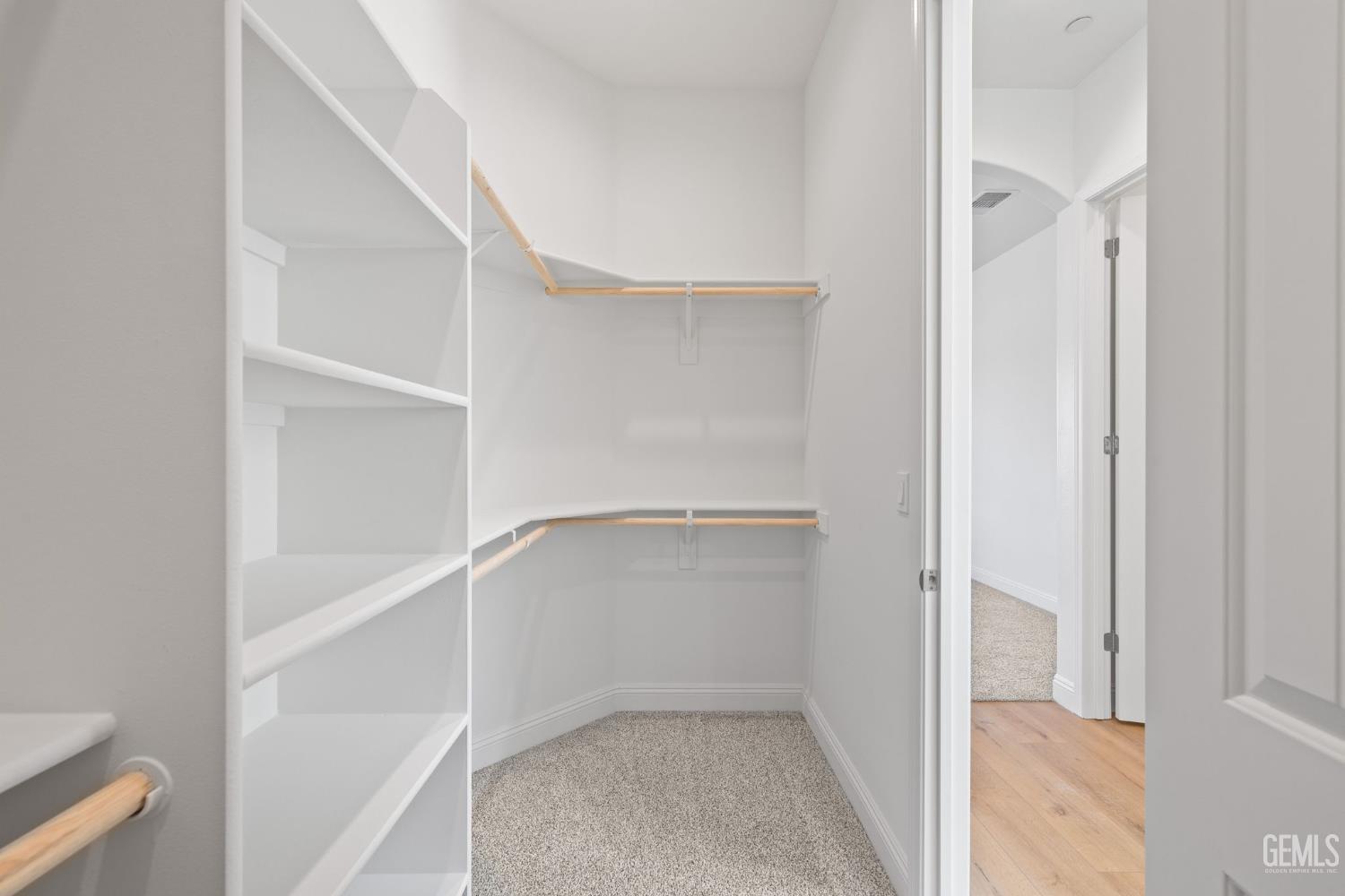 Undisclosed Address Bakersfield, CA 93314 - Photo 31 of 43 a view of an empty walk in closet