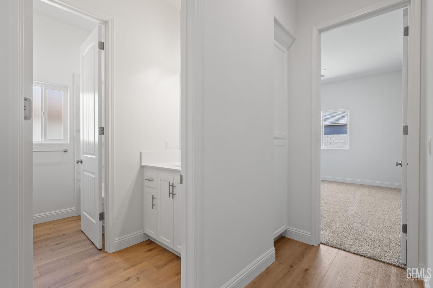 Undisclosed Address Bakersfield, CA 93314 - Photo 32 of 43 a view of a hallway with wooden floor