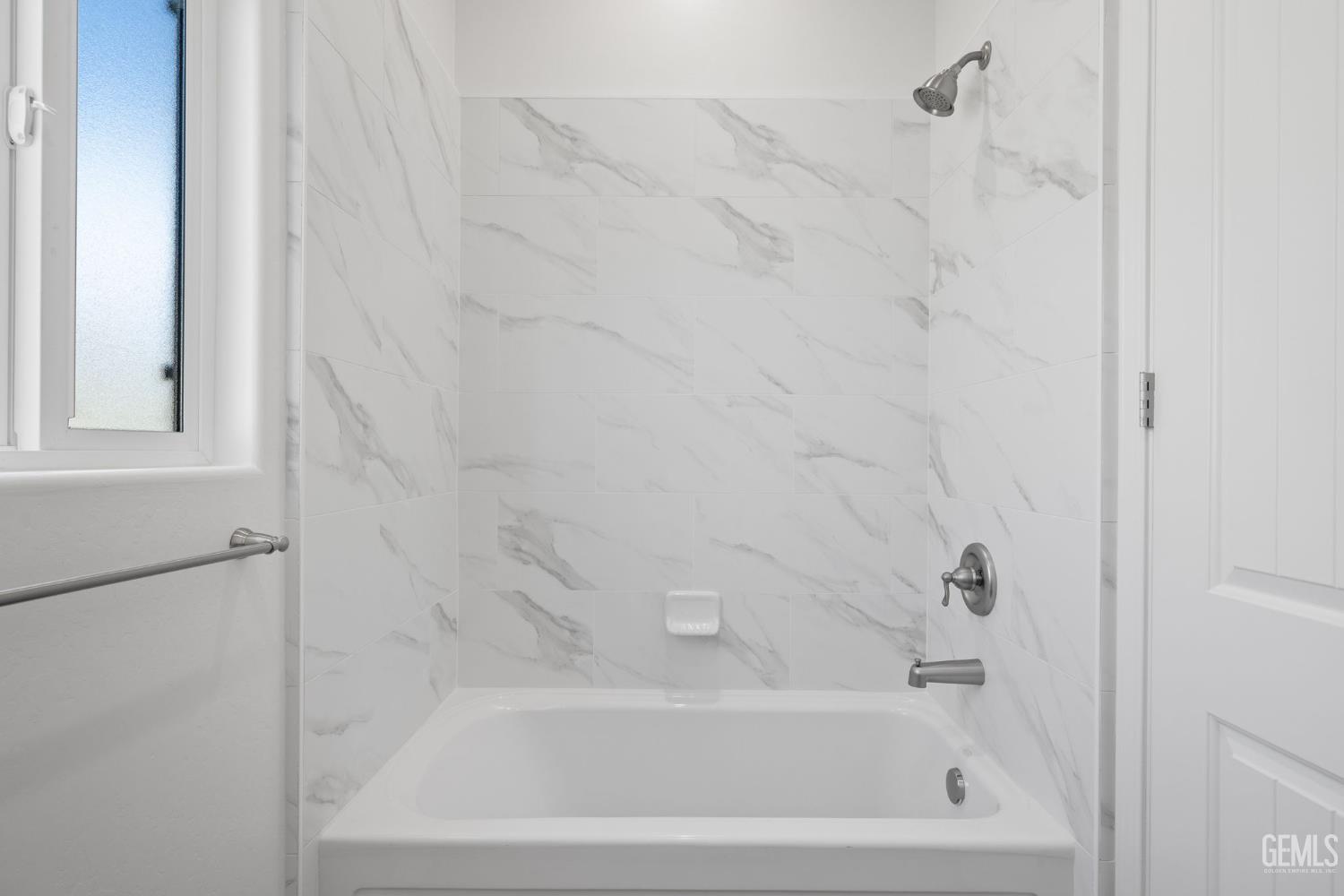 Undisclosed Address Bakersfield, CA 93314 - Photo 36 of 43 a bathroom with a bathtub