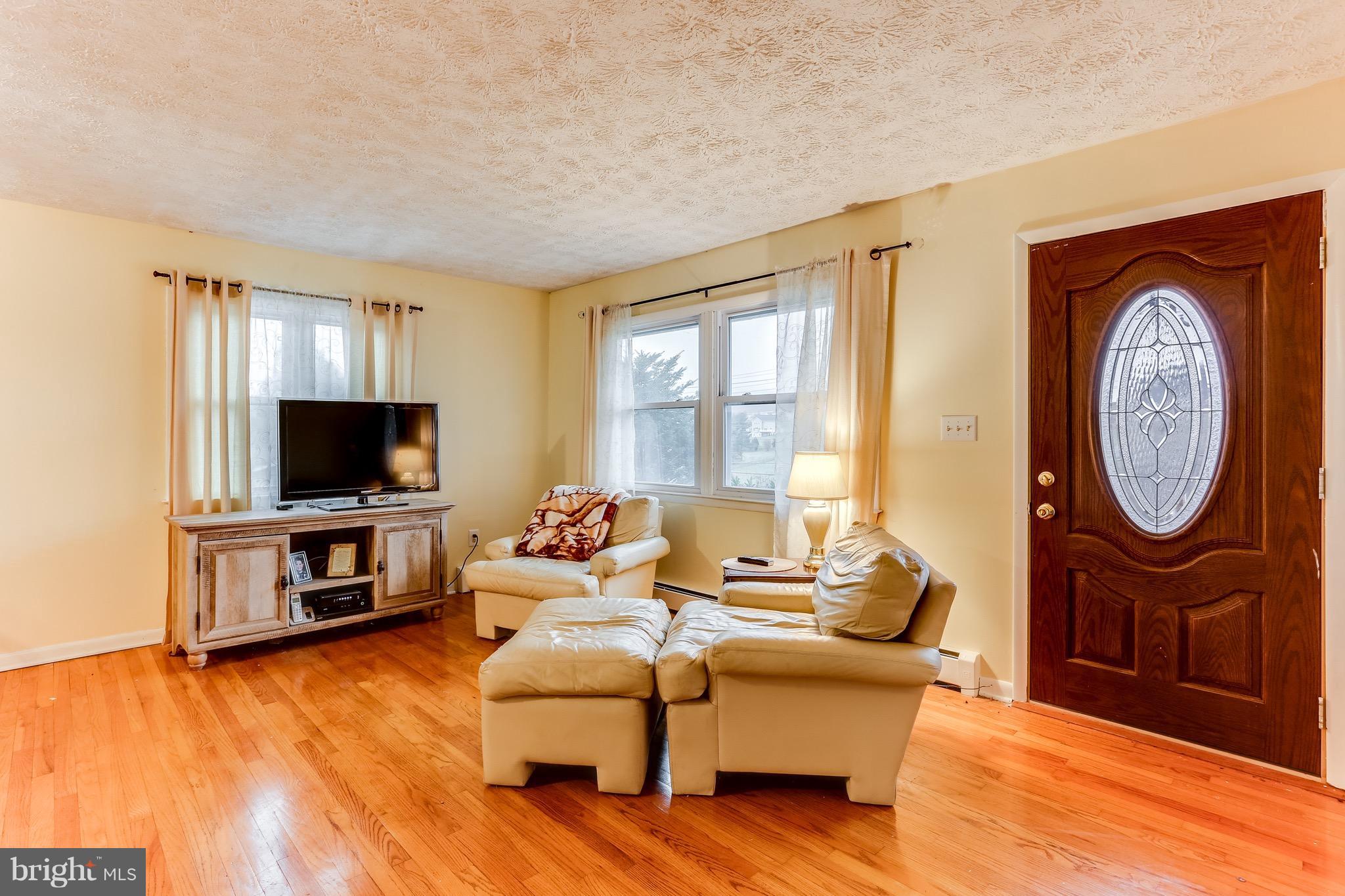 2229 Gablehammer Road Westminster, MD 21157 - Photo 2 of 30 a living room with furniture and a flat screen tv