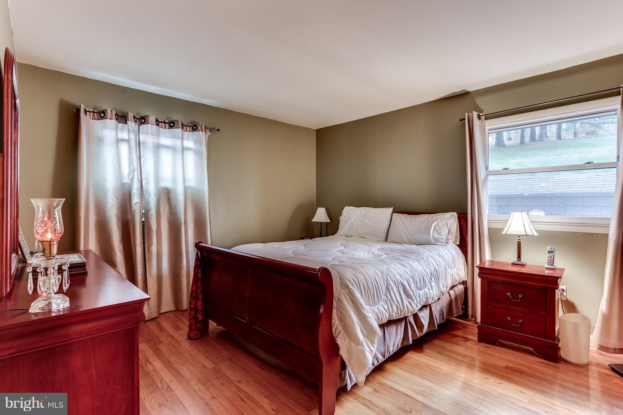 2229 Gablehammer Road Westminster, MD 21157 - Photo 13 of 30 a bedroom with a bed and a flat tv screen on dresser