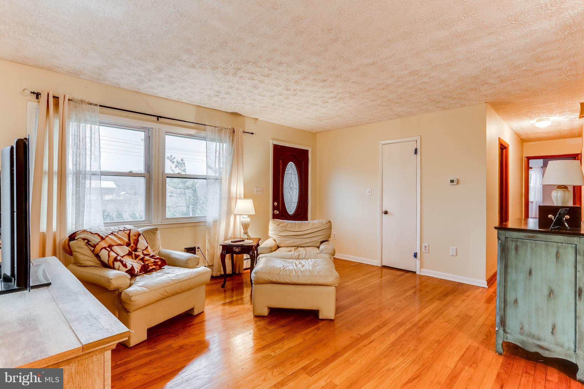 2229 Gablehammer Road Westminster, MD 21157 - Photo 6 of 30 a living room with furniture and wooden floor