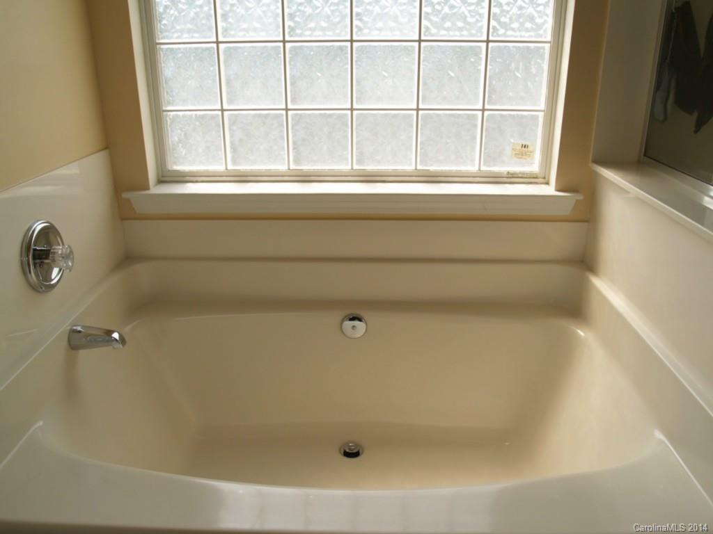 10402 Gold Pan Road Charlotte, NC 28215 - Photo 11 of 21 a bathroom with a bathtub