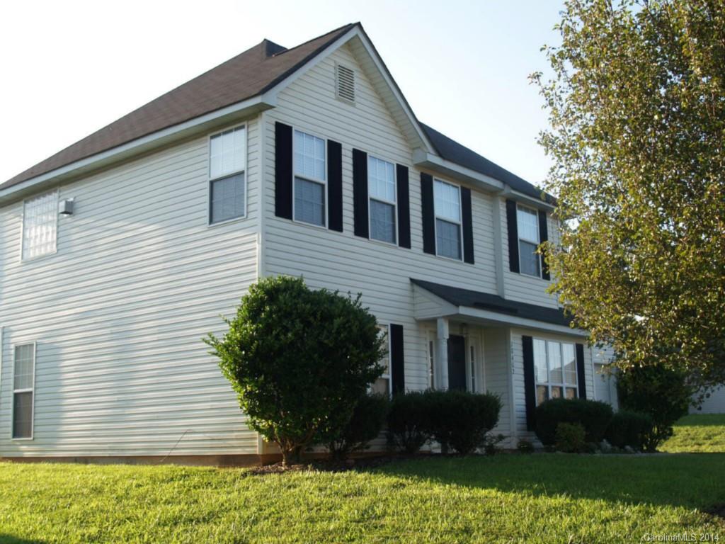 10402 Gold Pan Road Charlotte, NC 28215 - Photo 16 of 21 a front view of a house with a yard