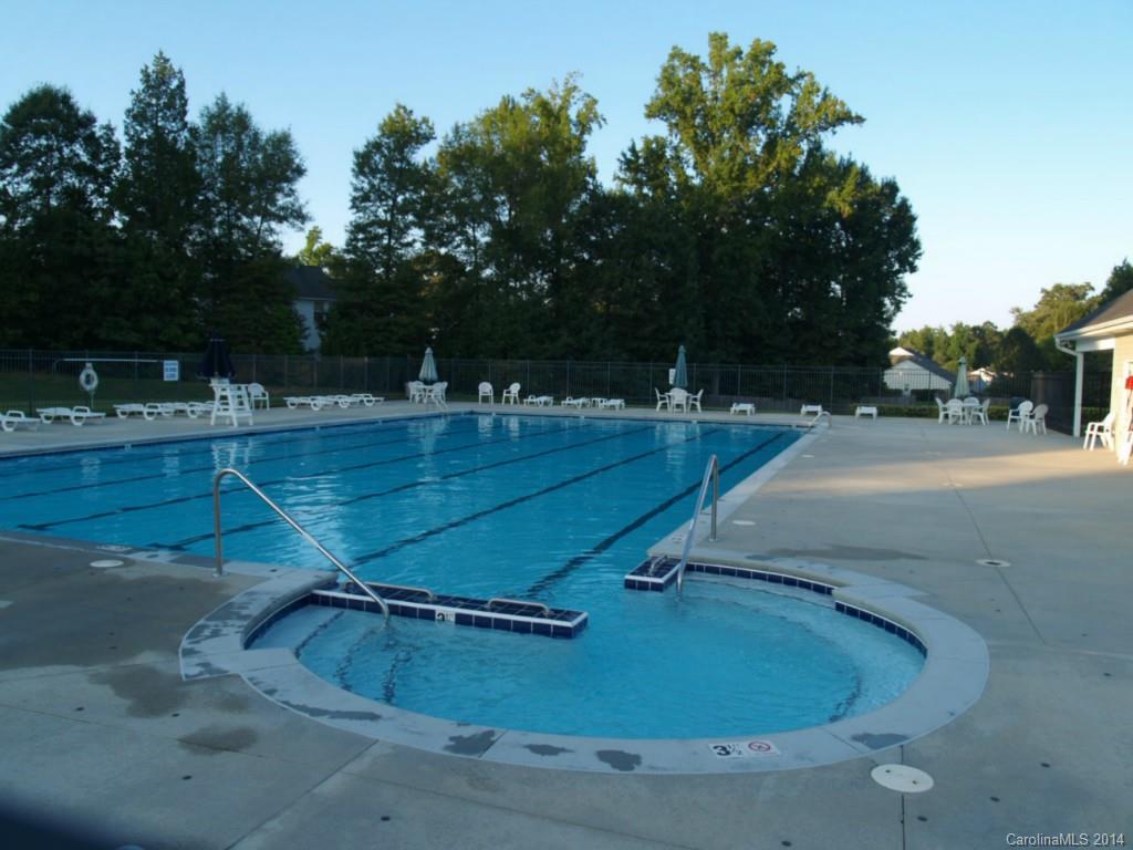 10402 Gold Pan Road Charlotte, NC 28215 - Photo 21 of 21 a view of a swimming pool with a yard