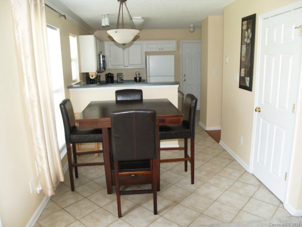 10402 Gold Pan Road Charlotte, NC 28215 - Photo 8 of 21 a view of a dining room with furniture and window