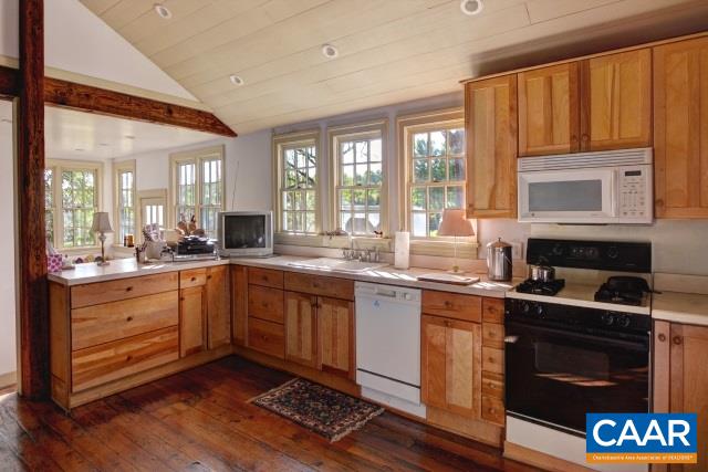 1928 Little Creek Road Dillwyn, VA 23936 - Photo 10 of 15 a kitchen with granite countertop wooden cabinets stainless steel appliances and a large window