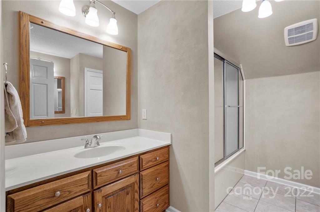 1215 Shive Road Salisbury, NC 28146 - Photo 33 of 48 a bathroom with a sink a vanity and a mirror