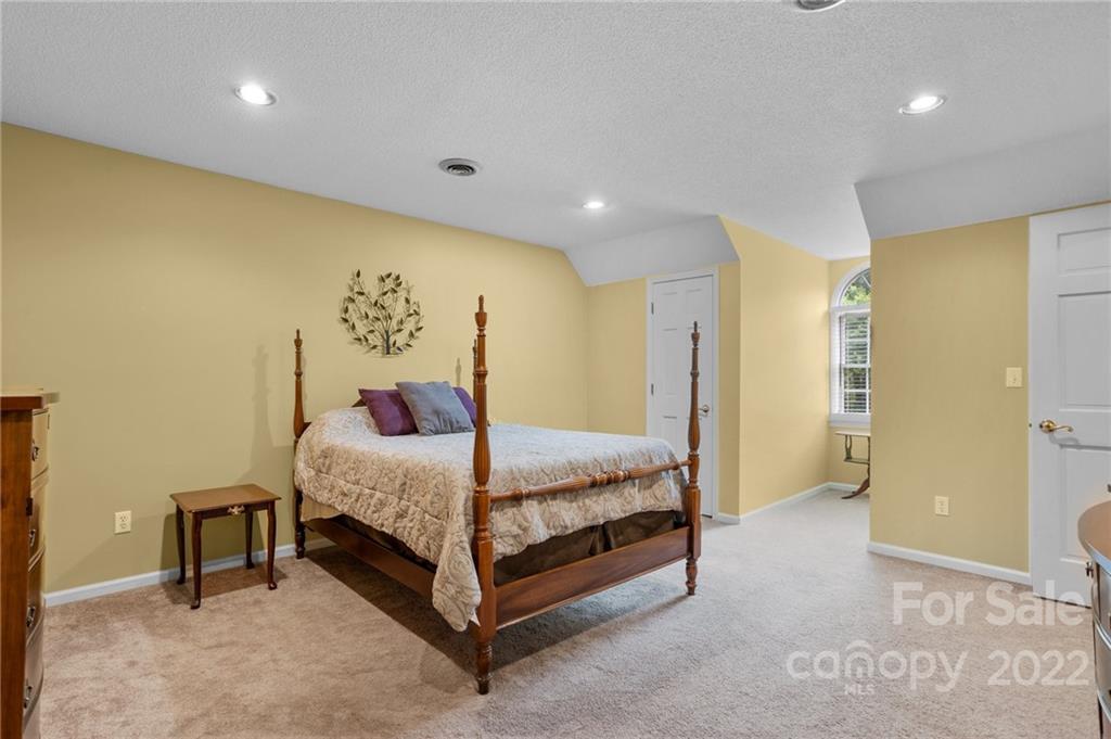 1215 Shive Road Salisbury, NC 28146 - Photo 35 of 48 a bedroom with a bed and a painting on the wall