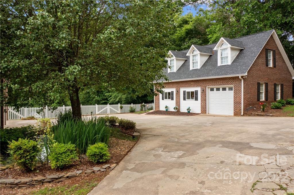 1215 Shive Road Salisbury, NC 28146 - Photo 5 of 48 a front view of a house with a garden